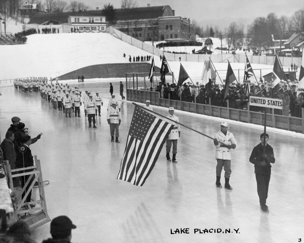 Lake Placid 1932 Winter OG, Opening Ceremony -The delegation from the United States of America (USA). On the ice, journalists from NBC.